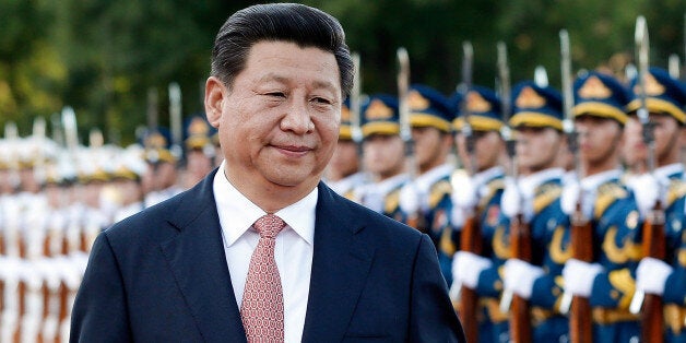 BEIJING, CHINA - SEPTEMBER 04: Chinese President Xi Jinping attends welcoming ceremony for Malaysia's Yang di-Pertuan Agong Tuanku Alhaj Abdul Halim Mu'adzam Shah outside the Great Hall of the People on September 4, 2014 in Beijing, China. The invitation of President Xi Jinping, Sultan Tuanku Alhaj Abdul Halim Mu'Adzam Shah of Malaysia will pay a state visit to China from September 3rd to 8th. (Photo by Lintao Zhang/Getty Images)