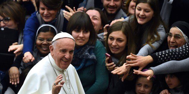 Pope Francis arrives for a special audience for the Cassano allo Jonio diocese at the Vatican on February 21, 2015. AFP PHOTO / GABRIEL BOUYS (Photo credit should read GABRIEL BOUYS/AFP/Getty Images)