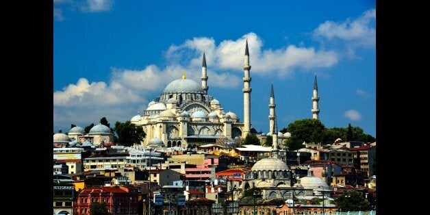Like the other imperial mosques in Istanbul, the mosque itself is preceded by a monumental courtyard (avlu) on its west side. The courtyard at the Süleymaniye is of exceptional grandeur with a colonnaded peristyle with columns of marble, granite and porphyry. At the four corners of the courtyard are the four minarets, a number only allowable to mosques endowed by a sultan (princes and princesses could construct two minarets; others only one). The minarets have a total of 10 galleries (serifes), which by tradition indicates that Suleiman I was the 10th Ottoman sultan. The main dome is 53 meters high and has a diameter of 27.5 meters. At the time it was built, the dome was the highest in the Ottoman Empire, when measured from sea level, but still lower from its base and smaller in diameter than that of Hagia Sophia. Interior Interior of the Süleymaniye. The interior of the mosque is almost a square, 59 meters in length and 58 meters in width, forming a single vast space. The dome is flanked by semi-domes, and to the north and south arches with tympana-filled windows, supported by enormous porphyry monoliths. Sinan decided to make a radical architectural innovation to mask the huge north-south buttresses needed to support these central piers. He incorporated the buttresses into the walls of the building, with half projecting inside and half projecting outside, and then hid the projections by building colonnaded galleries. There is a single gallery inside the structure, and a two-story gallery outside.
