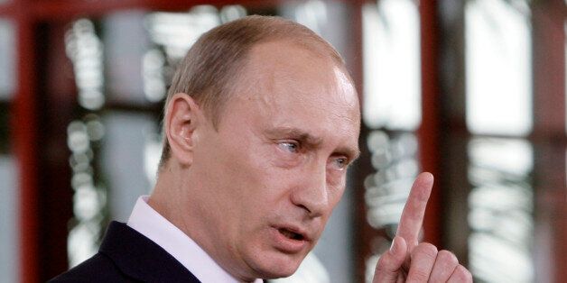 Russia's president Vladmir Putin gesturesduring a joint news conference with Italy's Premier-elect Silvio Berlusconi (not visible), after talks in Berlusconi's luxury 'Villa Certosa' in Porto Rotondo, on the island region of Sardinia, Italy, Friday, April 18, 2008. (AP Photo/Luca Bruno)
