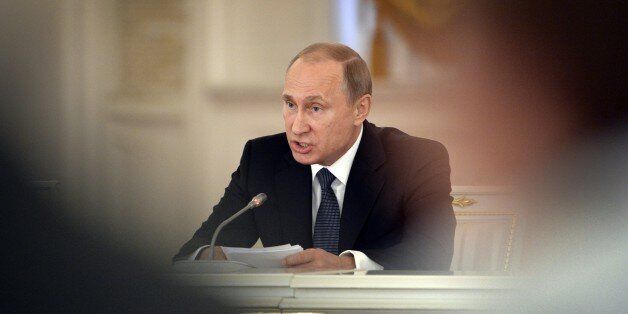 Russian President Vladimir Putin delivers a speech during a meeting of the Council for Interethnic Relations and the Council for the Russian Language at the Kremlin in Moscow on May 19, 2015. AFP PHOTO / ALEXANDER NEMENOV (Photo credit should read ALEXANDER NEMENOV/AFP/Getty Images)
