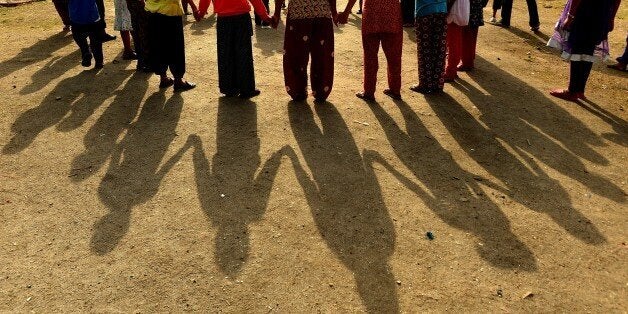 Nepalese children play at a relief camp for survivors of the Nepal earthquake in Kathmandu on May 26, 2015. Hundreds of Nepalis gathered on May 25 at the rubble of a 19th-century tower in Kathmandu to mark one month since a devastating earthquake killed more than 8,600 people in the Himalayan nation. The quake, which was followed by a second major tremor on May 12, brought down buildings across the country including historic temples, monuments and the much-loved Dharahara tower as tourists and locals climbed its more than 200 steps. AFP PHOTO / ISHARA S. KODIKARA (Photo credit should read Ishara S.KODIKARA/AFP/Getty Images)