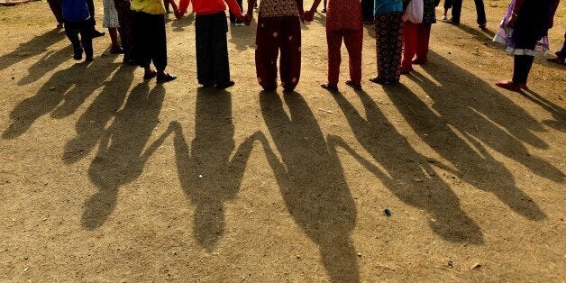 Nepalese children play at a relief camp for survivors of the Nepal earthquake in Kathmandu on May 26, 2015. Hundreds of Nepalis gathered on May 25 at the rubble of a 19th-century tower in Kathmandu to mark one month since a devastating earthquake killed more than 8,600 people in the Himalayan nation. The quake, which was followed by a second major tremor on May 12, brought down buildings across the country including historic temples, monuments and the much-loved Dharahara tower as tourists and locals climbed its more than 200 steps. AFP PHOTO / ISHARA S. KODIKARA (Photo credit should read Ishara S.KODIKARA/AFP/Getty Images)