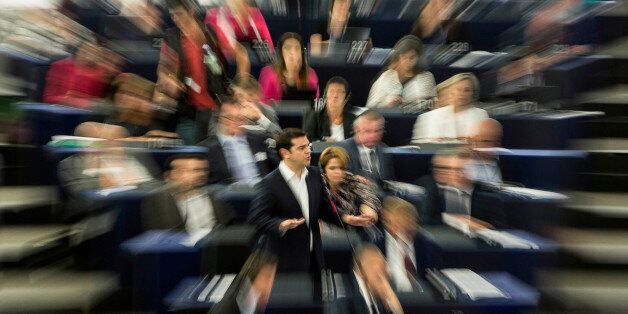 Greek Prime Minister Alexis Tsipras delivers his speech at the European Parliament in Strasbourg, eastern France, Wednesday, July 8, 2015. Tsipras says his country wants a deal that will mean a definitive end to GreeceÃs protracted financial crisis, and that last SundayÃs referendum result does not mean a break with Europe. (AP Photo/Jean-Francois Badias)