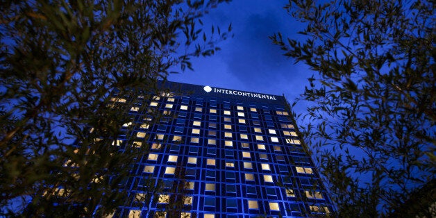 A view of the front of the Intercontinental Hotel after sunset during talks over Iran's nuclear programme on November 23, 2013 in Geneva. Iranian and Western officials poured cold water on hopes that a landmark nuclear deal was all but sewn up after world power foreign ministers flew in to join talks with Tehran in Geneva. 'We have now entered a very difficult stage,' Iranian Foreign Minister Mohammad Javad Zarif told state television from the third round of talks in six weeks in Switzerland. AFP PHOTO / FABRICE COFFRINI (Photo credit should read FABRICE COFFRINI/AFP/Getty Images)