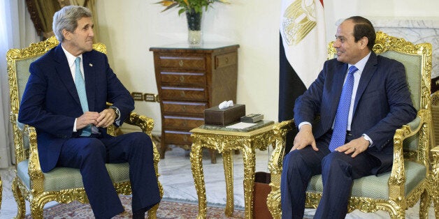 Egypt's President Abdel-Fattah el-Sissi, right, and U.S. Secretary of State John Kerry sit for photos before their meeting at the presidential palace in Cairo, Egypt, Sunday, Aug. 2, 2015. Despite persistent human rights concerns, the United States on Sunday resumed formal security talks with Egypt that were last held six years ago and kept on hiatus until now amid the political unrest that swept the country in the wake of the Arab Spring. (Brendan Smialowski/Pool Photo via AP)