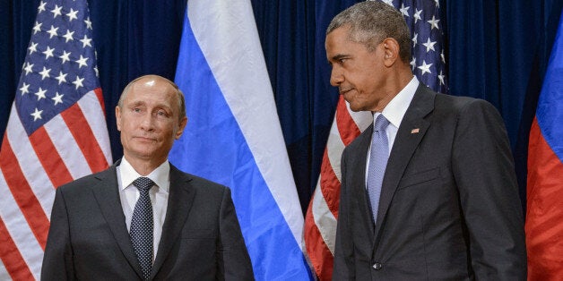 NEW YORK, NY - SEPTEMBER 28: Russian President Vladimir Putin (L) and U.S. President Barack Obama stand for the cameras before the start of a bilateral meeting at the United Nations headquarters on September 28, 2015 in New York City. Putin and Obama are in New York City to attend the 70th anniversary general assembly meetings. (Photo by Dmitry Azarov/Kommersant Photo via Getty Images)