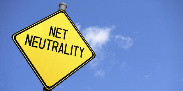 A yellow warning sign with the text 'Net Neutrality' against a blue sky.