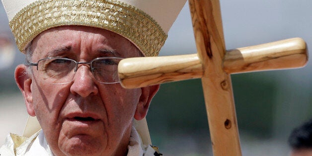 Pope Francis walks with his pastoral staff to celebrate a mass in Guayaquil, Ecuador, Monday, July 6, 2015. Francis' pastoral staff is a replica of a wooden staff that had been made for him by prisoners of an Italian detention facility that was subsequently lost or damaged. During Francis trip to the Holy Land last year, he received a replica made from olive wood, which is the staff he used Tuesday. The Vatican spokesman, the Rev. Federico Lombardi, said it would likely become Francis' "travel staff" for use on foreign trips. (AP Photo/Gregorio Borgia)