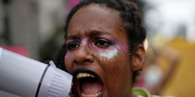 A woman shouts slogans against possible changes in abortion laws during a protest while Congress debates the changes in Rio de Janeiro, Brazil, Wednesday, Oct. 28, 2015. The proposed bill would make it a crime to induce or assist a pregnant woman with an abortion. Currently, only women who were raped, whose life is in danger, or whose fetus is gravely deformed, can legally have an abortion. The new law, if passed, would require the rape victim to get a forensic exam and file a police report to prove they are the victim of sexual violence. (AP Photo/Silvia Izquierdo)