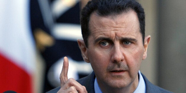 Syria President Bashar al-Assad addresses reporters following his meeting with French President Nicolas Sarkozy at the Elysee Palace in Paris, Thursday Dec. 9, 2010. (AP Photo/Remy de la Mauviniere)