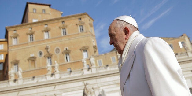 Pope Francis arrives to hold his weekly general audience, in St. Peter's Square, at the Vatican, Wednesday, Dec. 30, 2015. (AP Photo/Andrew Medichini)