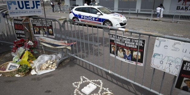 TO GO WITH AFP STORY BY SIMON VALMARY A photo taken on June 26, 2015 shows a police car parked behind metal barriers outside the Hypercacher kosher supermarket at Porte de Vincennes in Paris, six months after a bloody hostage drama at the supermarket during a jihadist attack on January 9 left four dead. AFP PHOTO / KENZO TRIBOUILLARD (Photo credit should read KENZO TRIBOUILLARD/AFP/Getty Images)