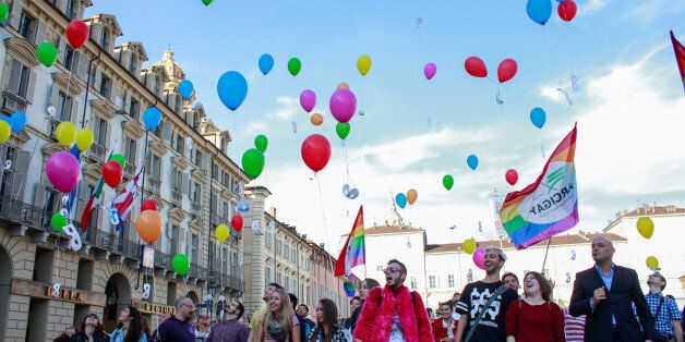 TURIN, ITALY - 2015/10/11: The Youth Group of Arcigay Torino organized a flash mob during the World Day of Coming Out to send a positive message about all those people who are afraid to declare themselves homosexual because of the discrimination. The colorful balloons, a symbol of peace, were flown in the sky with white masks attacked. (Photo by Elena Aquila/Pacific Press/LightRocket via Getty Images)