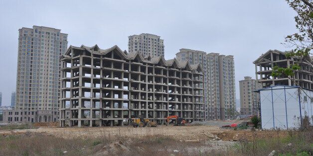 RIZHAO, CHINA - MAY 10: (CHINA OUT) Unfinished buildings are seen at Lanshan district on May 10, 2014 in Rizhao, Shandong province of China. Unfinished buildings at Lanshan district are the result of insufficient funds of real estate developers. (Photo by ChinaFotoPress/ChinaFotoPress via Getty Images)