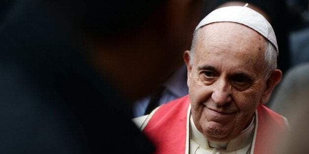 Pope Francis leaves after the Divine Lithurgy at St George church, the principal Greek Orthodox cathedral, on November 30, 2014 in Istanbul as part of a three day visit in Turkey. Pope Francis held an ecumenical prayer, yesterday, in the Orthodox Church of St. George and a private meeting with Patriarch Bartholomew I, the 'first among equals' of the world's estimated 300 million Orthodox believers. In a highly symbolic gesture, the pope asked Bartholomew to kiss his brow in a blessing and bowed his head to show humility. AFP PHOTO / FILIPPO MONTEFORTE (Photo credit should read FILIPPO MONTEFORTE/AFP/Getty Images)