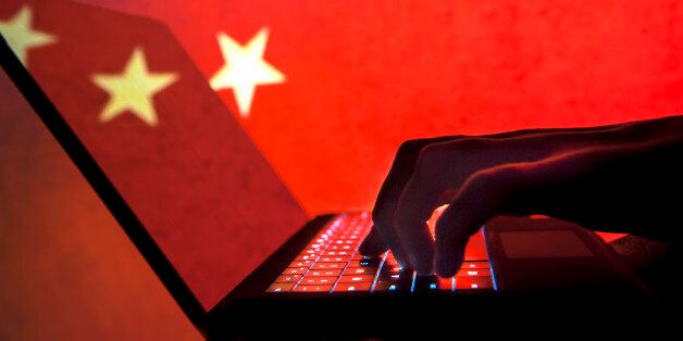 Cybercriminal, hacker China flag background.