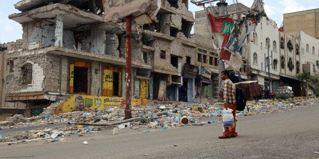 A picture taken on April 7, 2016, shows heavily damaged buildings on a street in Yemen's third city Taez as a result of clashes between Shiite Huthi rebels and fighters from the Popular Resistance Committees, loyal to Yemen's fugitive President Abedrabbo Mansour Hadi. A new ceasefire enters into effect in Yemen midnight on April 10, 2016, with the United Nations hoping it can be the cornerstone of a long-lasting peace deal at upcoming talks in Kuwait. / AFP / AHMAD AL-BASHA (Photo credit should read AHMAD AL-BASHA/AFP/Getty Images)