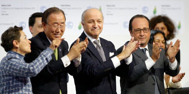 From L-R, Christiana Figueres, Executive Secretary of the UN Framework Convention on Climate Change, United Nations Secretary-General Ban Ki-moon, French Foreign Affairs Minister Laurent Fabius, President-designate of COP21 and French President Francois Hollande applaud during the final plenary session at the World Climate Change Conference 2015 (COP21) at Le Bourget, near Paris, France, December 12, 2015. REUTERS/Stephane Mahe 