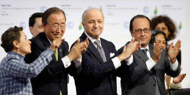 From L-R, Christiana Figueres, Executive Secretary of the UN Framework Convention on Climate Change, United Nations Secretary-General Ban Ki-moon, French Foreign Affairs Minister Laurent Fabius, President-designate of COP21 and French President Francois Hollande applaud during the final plenary session at the World Climate Change Conference 2015 (COP21) at Le Bourget, near Paris, France, December 12, 2015. REUTERS/Stephane Mahe