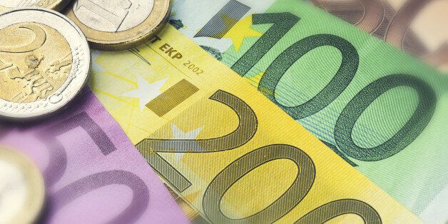 Euro banknotes and coins. Finance concept