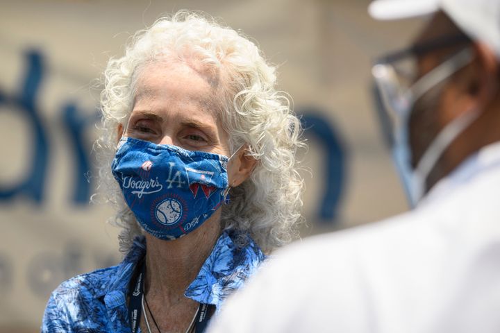 Los Angeles County Public Health Director Dr. Barbara Ferrer attends a COVID-19 mobile vaccine clinic at the Watts Juneteenth Street Fair in the Watts neighborhood of L.A. Ferrer has recommended that Angelenos continue to wear masks in indoor public spaces as the threat of the delta variant's transmission increases.