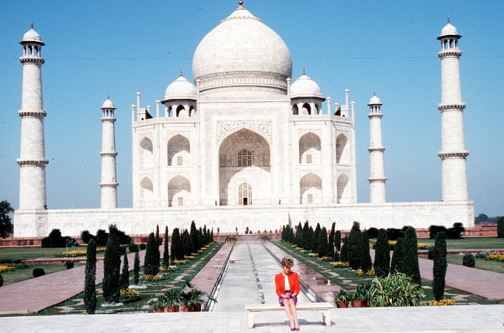 The Princess of Wales shows her loneliness as she poses alone at the Taj Mahal on February 11, 1992 during her visit to Agra, India. Twelve years earlier her husband, the Prince of Wales, posed in the same spot. 