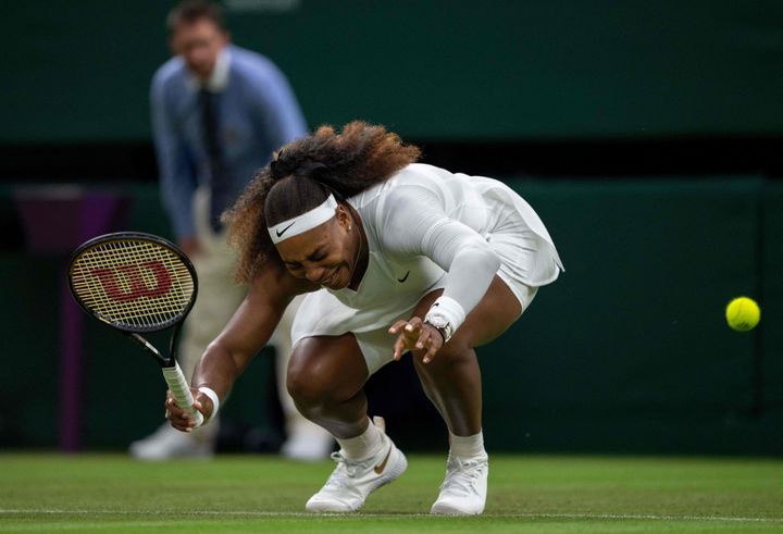 Serena Williams winces in pain before she eventually withdrew from the match.