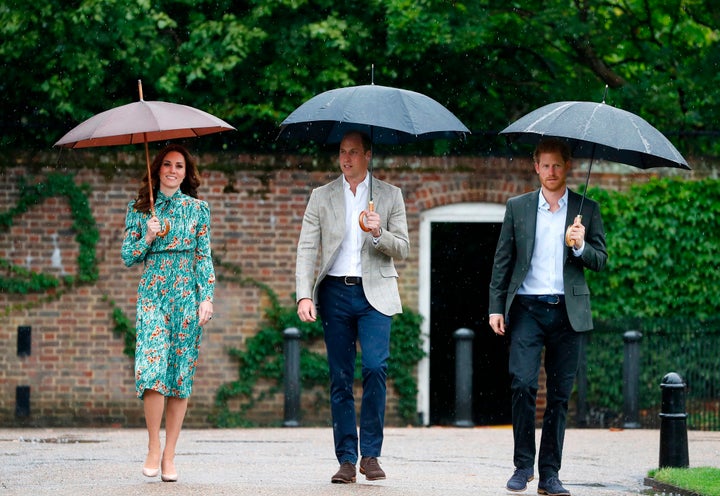 Princes William and Harry, with Kate Middleton, at the memorial gardens in Kensington Palace on Aug. 30, 2017. 