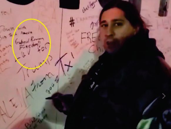 Gabriel Brown wrote his name on a trailer outside the U.S. Capitol and then said on camera, &ldquo;Freedom! I&rsquo;m signing