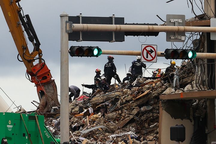 A team of rescue workers searches through the rubble of the Champlain Towers South building in Surfside, Florida, which collapsed last week.