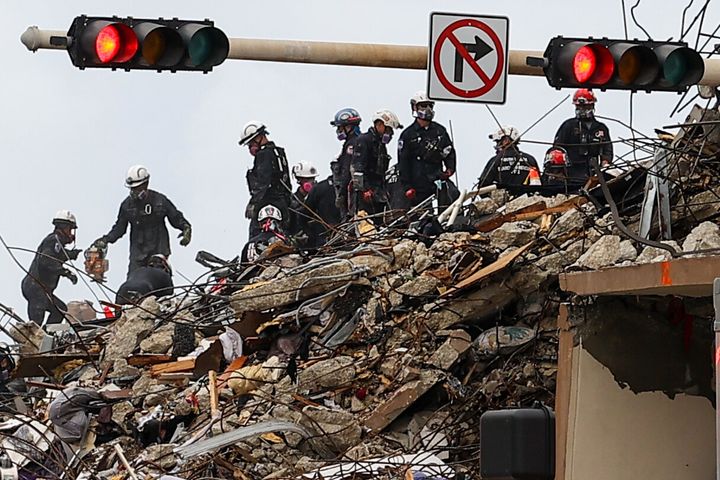 Rescue workers are seen at the site of the partially collapsed Champlain Tower in Surfside, Florida, on Wednesday.