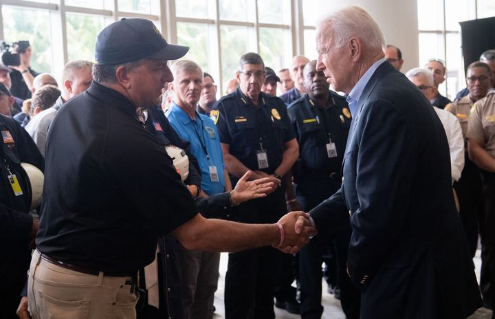 President Biden shakes hands with Jimmy Patronis, Florida's Chief Financial Officer, as he meets with first responders Thursday in Miami Beach.