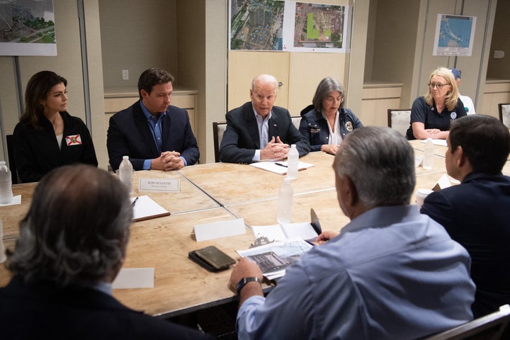 Biden speaks alongside Miami Dade County Mayor Daniella Levine Cava (R) and Florida Governor Ron DeSantis (L) about the colla