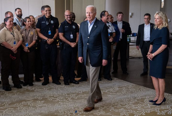 President Joe Biden and first lady Jill Biden greet first responders to the collapse of the 12-story Champlain Towers South condo building in Surfside, Florida, on Thursday.