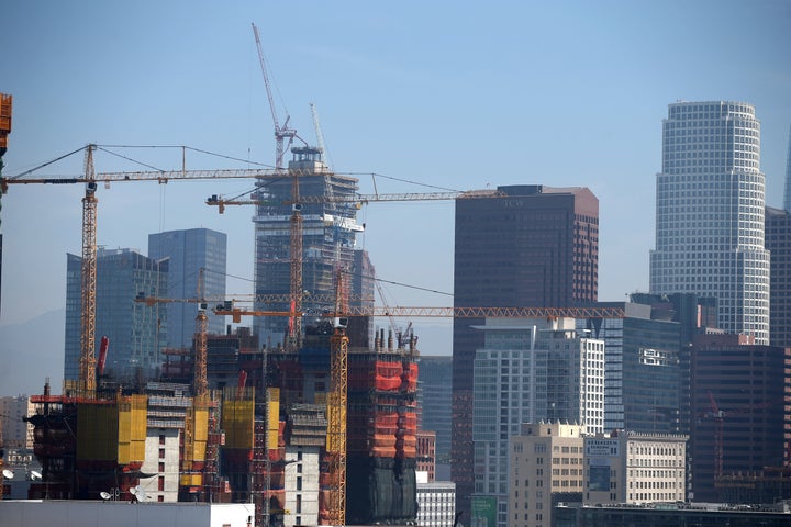 Construction cranes are seen in downtown Los Angeles.