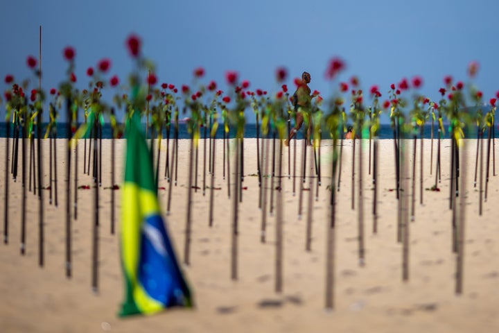 A makeshift memorial was "planted" on beaches in Rio de Janeiro in June to mark Brazil's recording of its 500,000th death rel