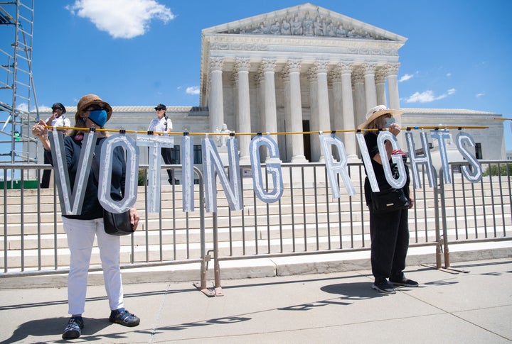 Demonstrators call for senators, specifically Manchin, to support the elimination of the Senate filibuster in order to pass voting rights legislation and economic relief bills during a protest in Washington, D.C. in June.