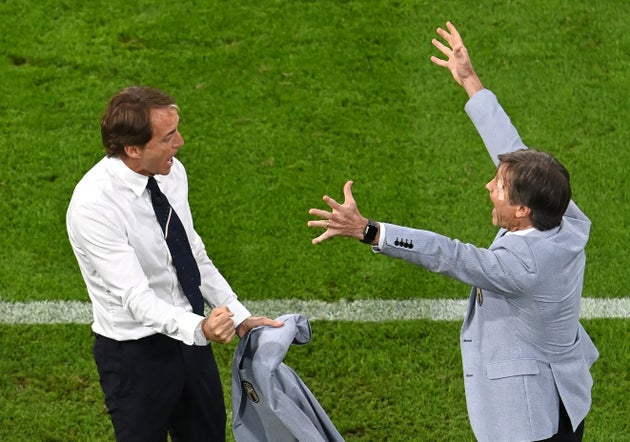 MUNICH, GERMANY - JULY 02: Roberto Mancini, Head Coach of Italy interacts with Gabriel Oriali, Team Manager...