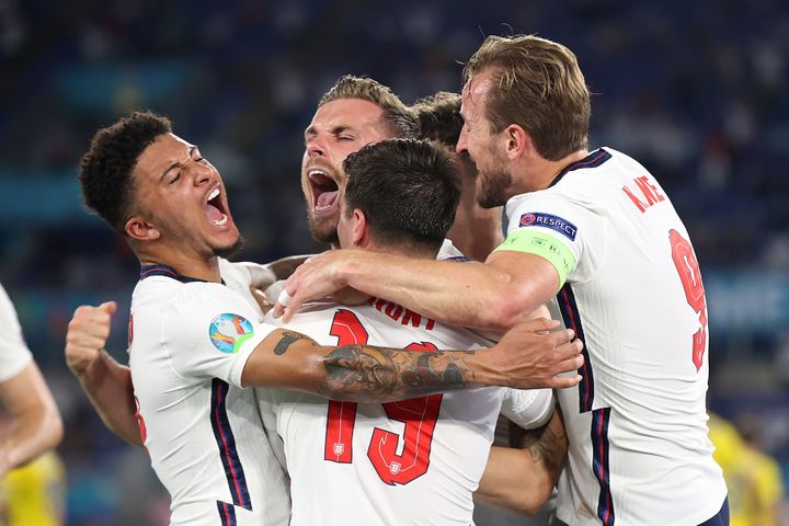 Jordan Henderson of England celebrates with Jadon Sancho, Mason Mount and Harry Kane after scoring their side's fourth goal during the UEFA Euro 2020 Championship Quarter-final match between Ukraine and England at Olimpico Stadium in Rome.