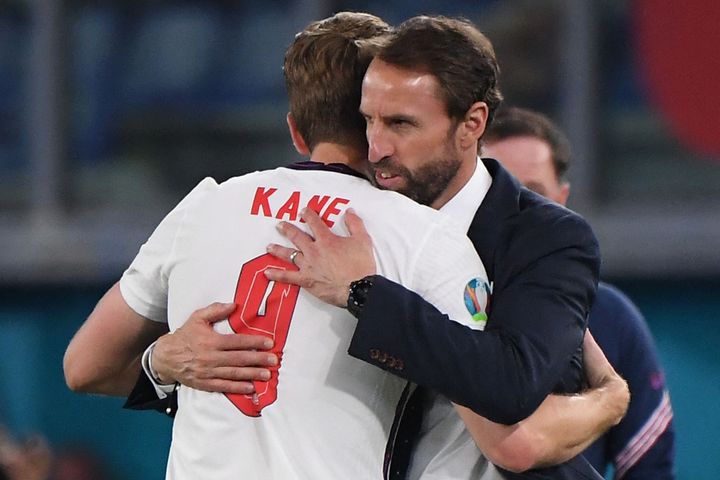 England's coach Gareth Southgate (R) greets England's forward Harry Kane after being substituted during the UEFA EURO 2020 quarter-final football match between Ukraine and England.