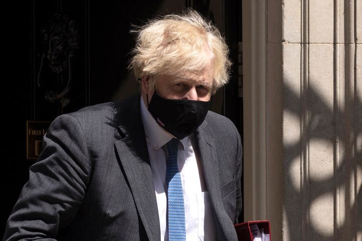 LONDON, ENGLAND - JUNE 23: British Prime Minister, Boris Johnson wearing a face mask, leaves 10 Downing Street to attend the weekly Prime Ministers Questions in the House of Commons on June 23, 2021 in London, England. (Photo by Dan Kitwood/Getty Images)