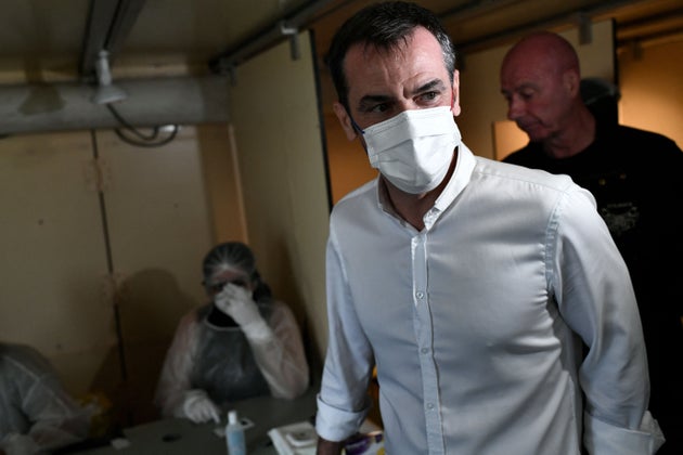 French Health Minister Olivier Veran visits a Covid-19 screening test facility set up at the 23rd edition of the festival dedicated this year to health workers, at the Hippodrome de Longchamp race course on July 4, 2021, in Paris. (Photo by STEPHANE DE SAKUTIN / AFP) (Photo by STEPHANE DE SAKUTIN/AFP via Getty Images)