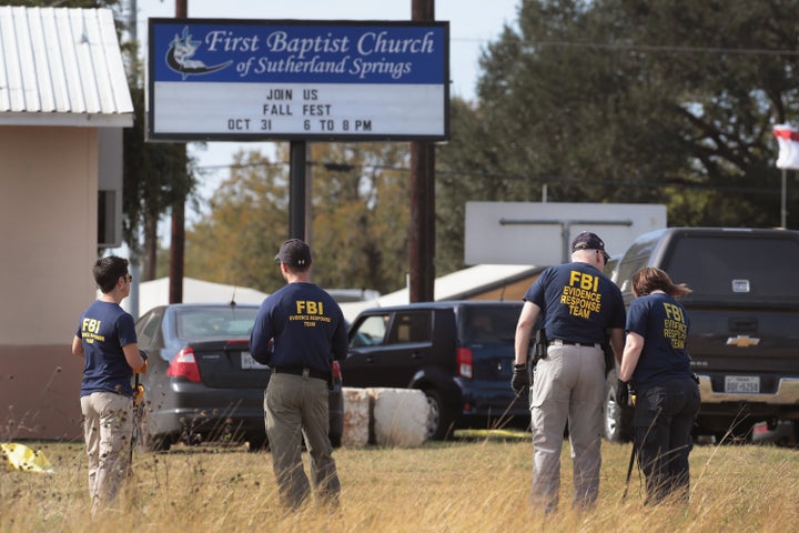 Law enforcement officials are seen at the scene of the 2017 mass shooting at the First Baptist Church of Sutherland Springs in Texas.