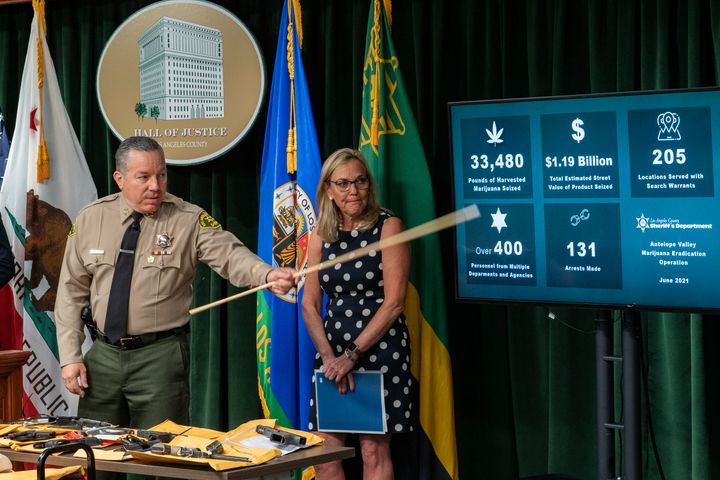 Los Angeles County Sheriff Alex Villanueva, left, and Supervisor Kathryn Larger, Los Angeles County Board of Supervisors, described the Antelope Valley Marijuana Eradication Operation statistics at a news conference downtown Los Angeles on Wednesday.