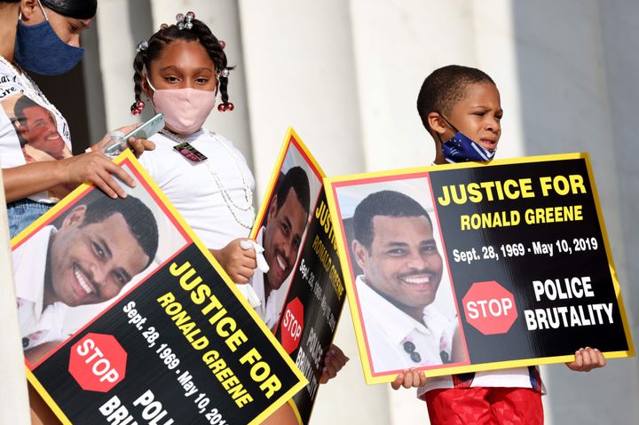 Family members of Ronald Greene attend a "Commitment March: Get Your Knee Off Our Necks" protest against racism and police brutality in Washington, D.C., in 2020.