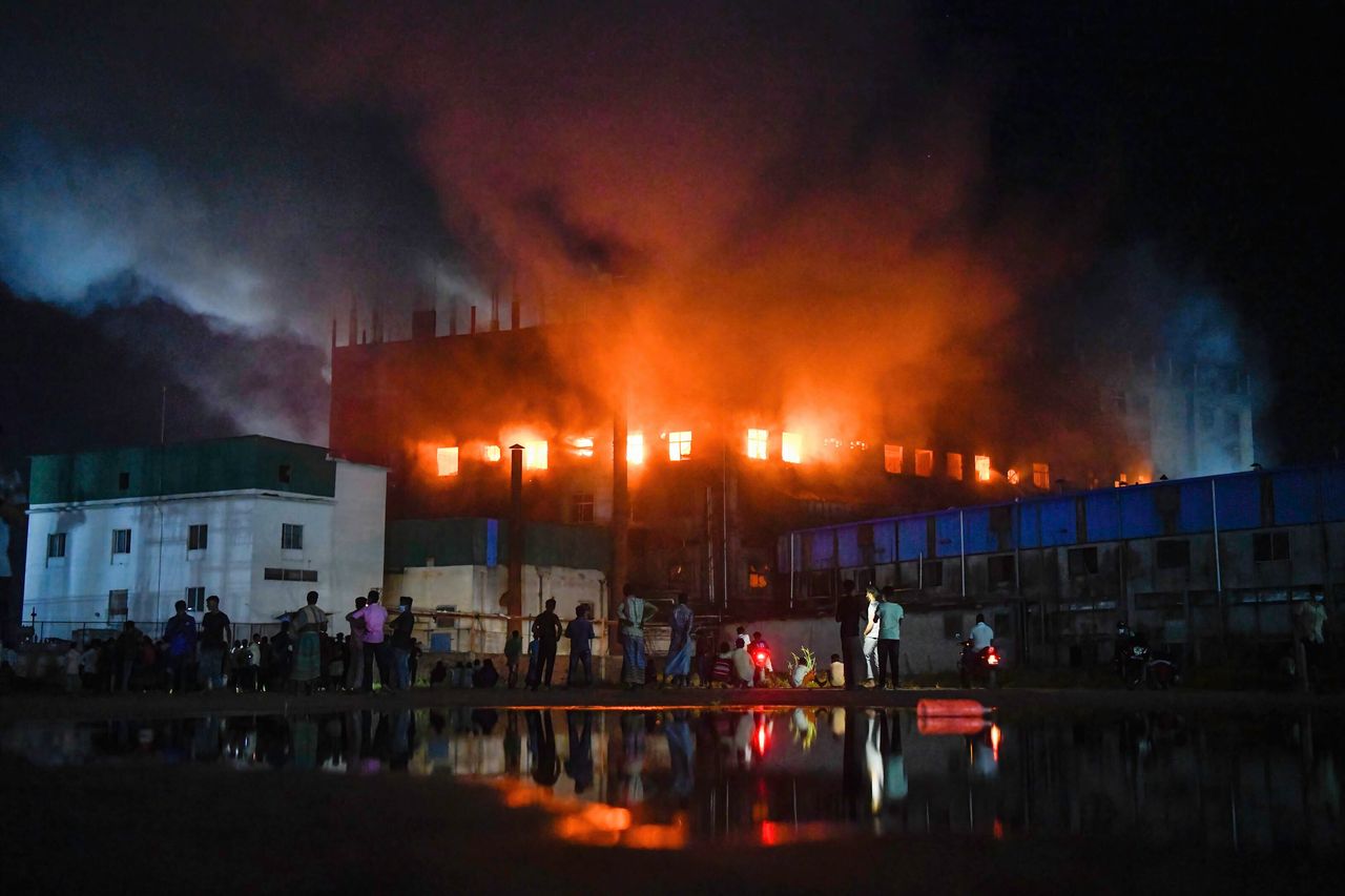 Firefighters try to extinguish fire inside the Hashem Foods Ltd factory on the outskirts of Dhaka. 