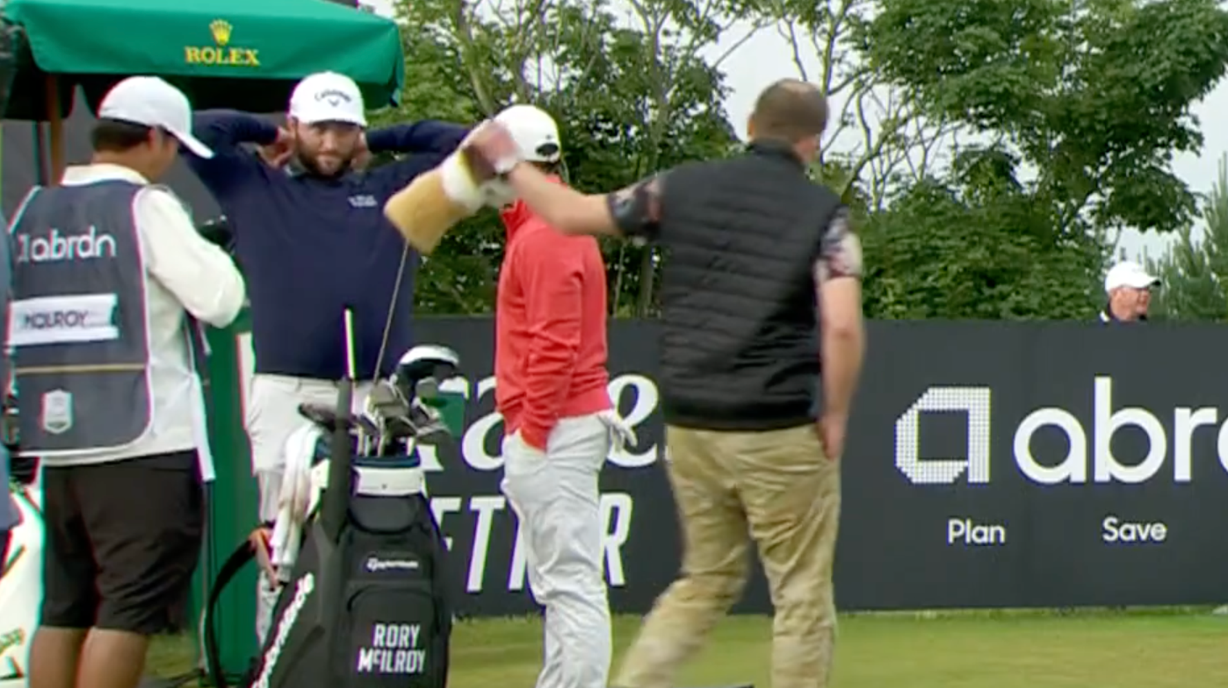 Spectator 'Borrows' Rory McElroy's Golf Club And Takes Practice Swing