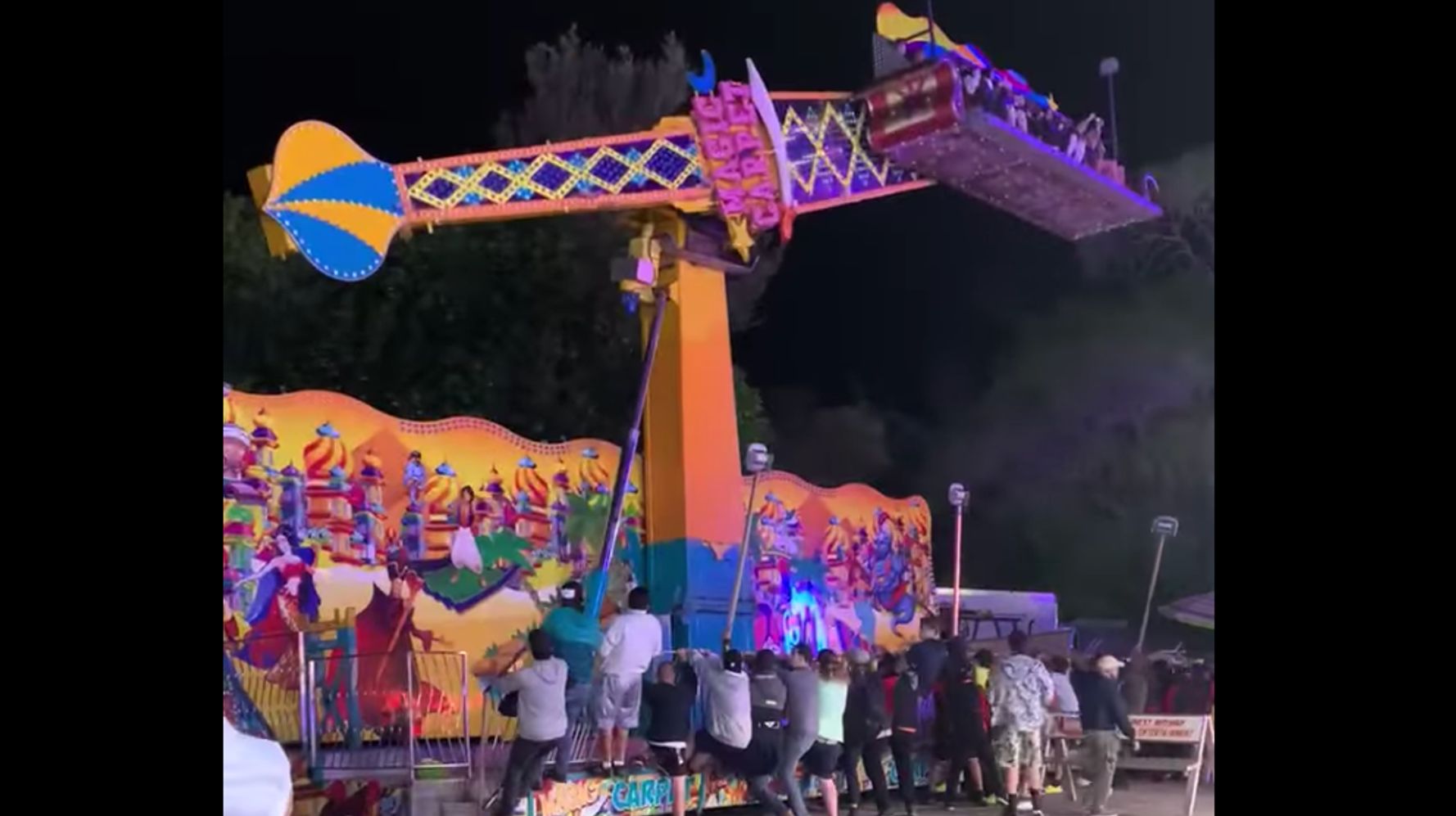 Carnivalgoers Rush To Stop Ride From Tipping Over At Michigan Fair