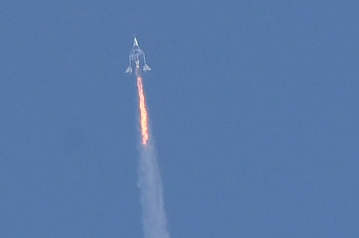 The Virgin Galactic SpaceShipTwo space plane Unity and mothership separate as they fly way above Spaceport America, near Truth and Consequences, New Mexico on July 11, 2021 on the way to the cosmos. - Billionaire Richard Branson took off July 11, 2021 from a base in New Mexico aboard a Virgin Galactic vessel bound for the edge of space, a voyage he hopes will lift the nascent space tourism industry off the ground.A massive carrier plane made a horizontal take-off from Spaceport, New Mexico at around 8:40 am Mountain Time (1440 GMT) and will ascend for around an hour to an altitude of 50,000 feet (15 kilometers).The mothership will then drop a rocket-powered spaceplane called VSS Unity, which will ignite its engine and ascend at Mach 3 beyond 50 miles (80 kilometers) of altitude, which marks the boundary of space according to the United States. (Photo by Patrick T. FALLON / AFP) (Photo by PATRICK T. FALLON/AFP via Getty Images)